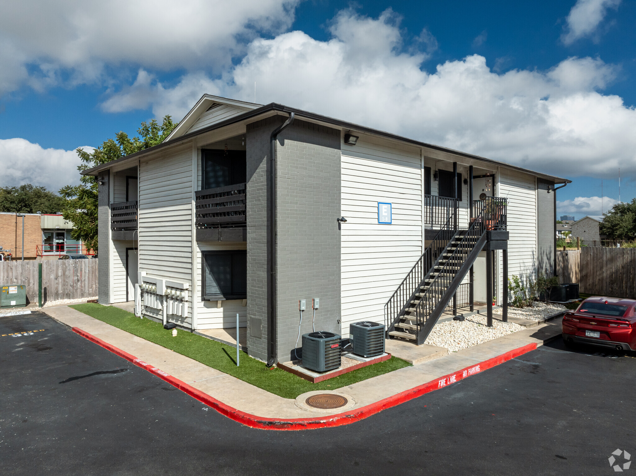 the apartment complex is located in a parking lot at The Colony Creek Apartments