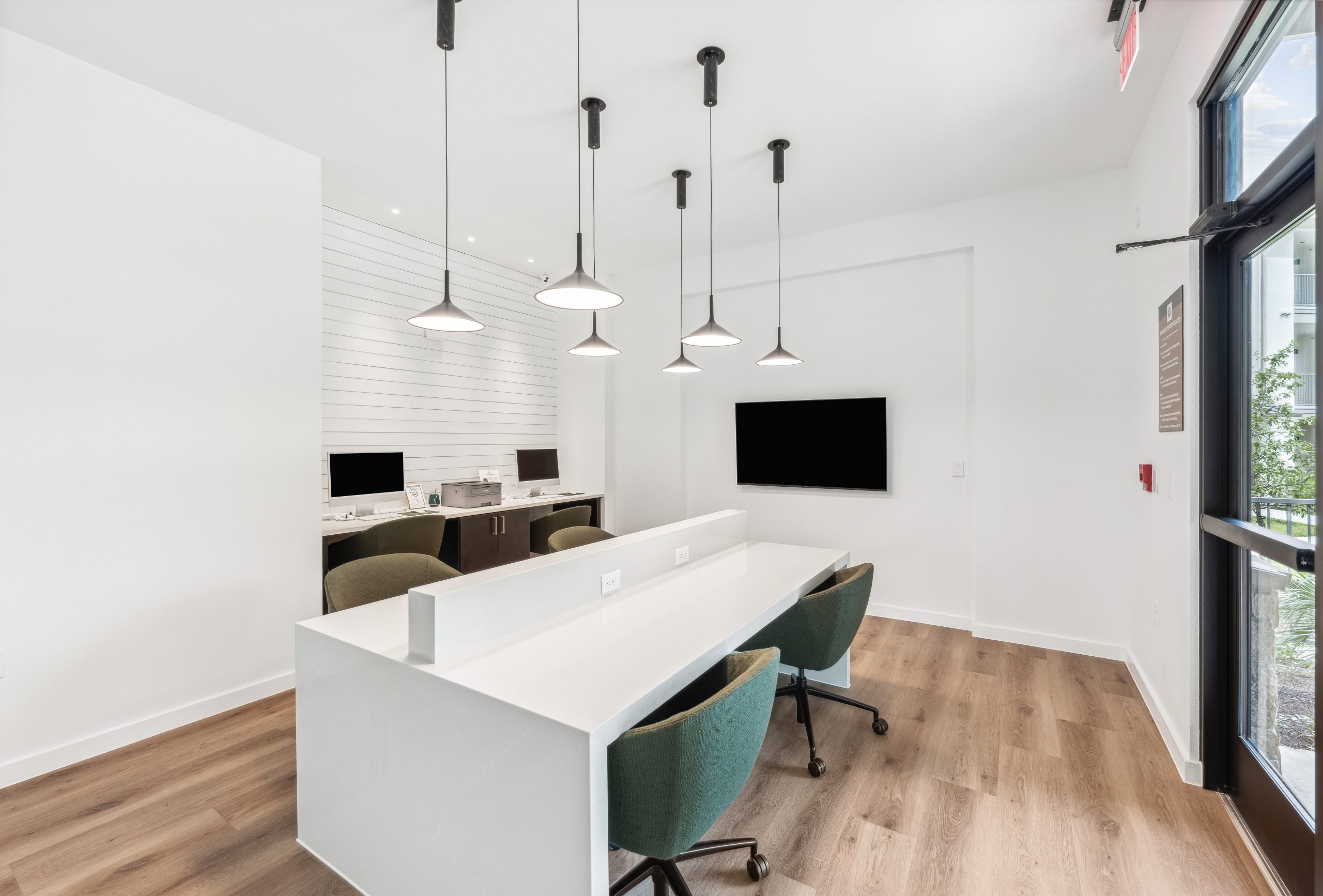 a white office with a desk and chairs at The Rushcreek