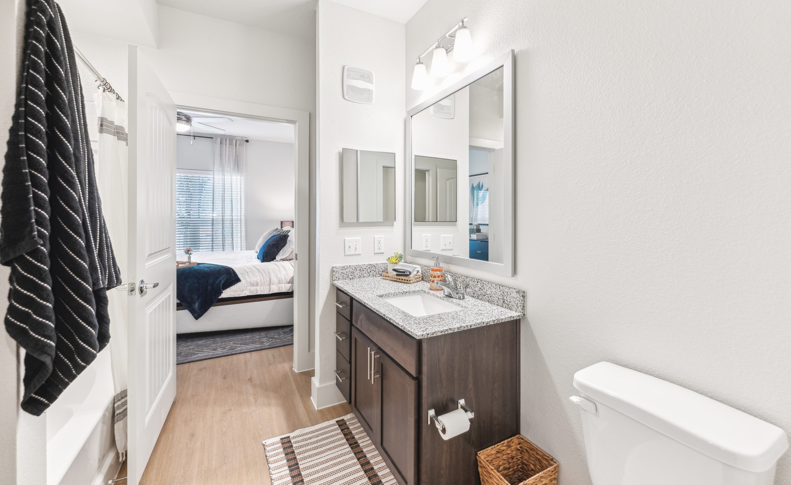 a bathroom with a sink, toilet and mirror at The Rushcreek