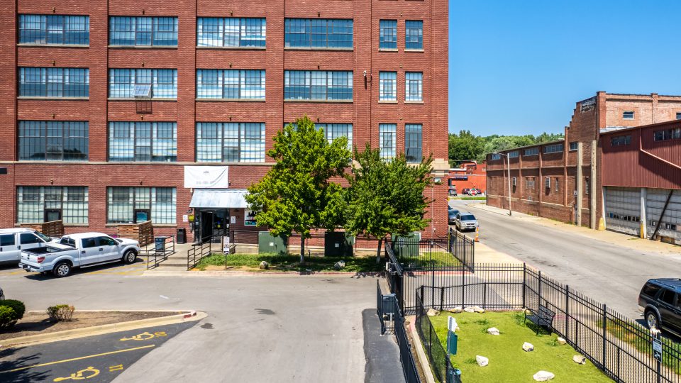a city street with a tall brick building
