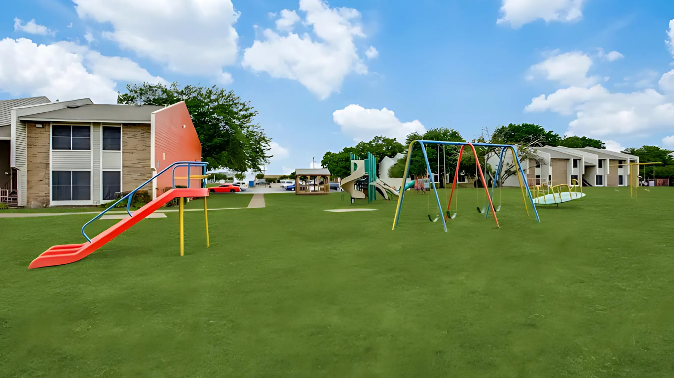 a 3d rendering of a playground with a slide and swings at The Meadows on Merrill