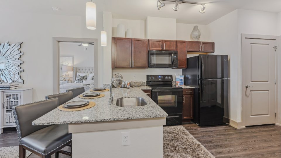 the kitchen and dining area of a new apartment at The Steelyard Apartments