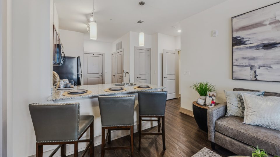the living room and kitchen area of a new apartment at The Steelyard Apartments