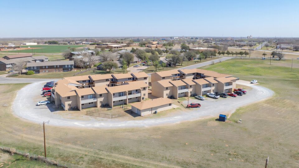 an aerial view of a large ranch with a large parking lot at The  Courtyard