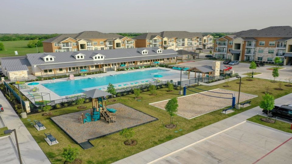 an aerial view of a pool and apartment complex at The Biltmore at  Park
