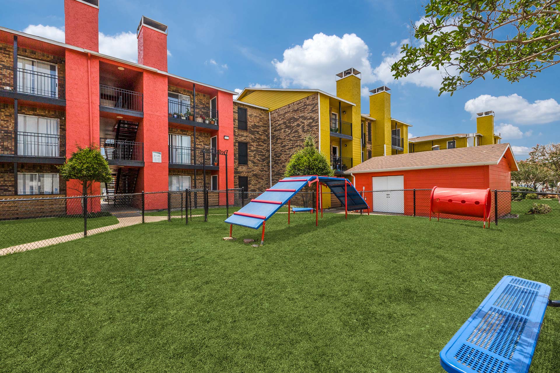 a colorful playground with a slide and a slide at The Dahlia