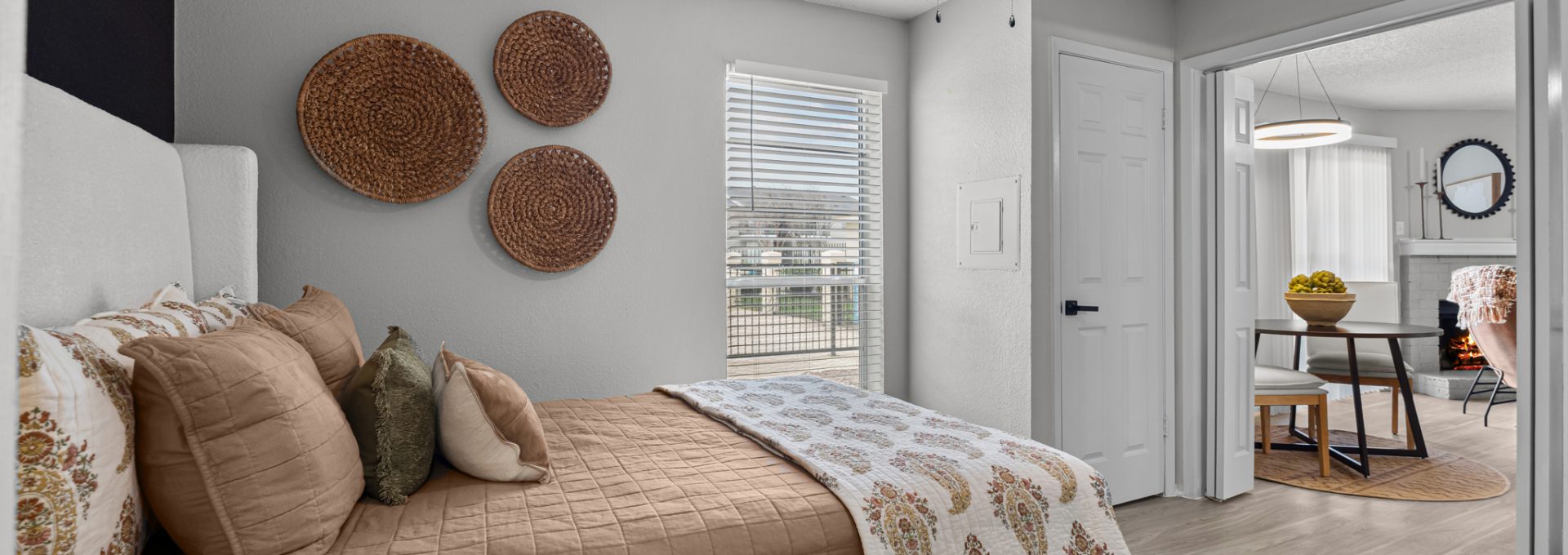 a bedroom with a ceiling fan and a bed at The  Dahlia