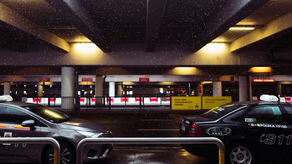 black sedan parked in parking lot
