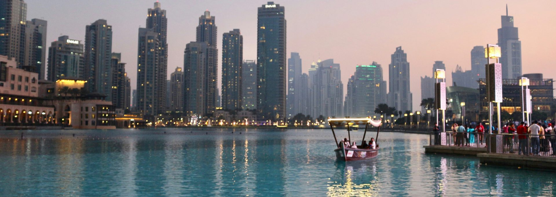 body of water with high-rise building in distance
