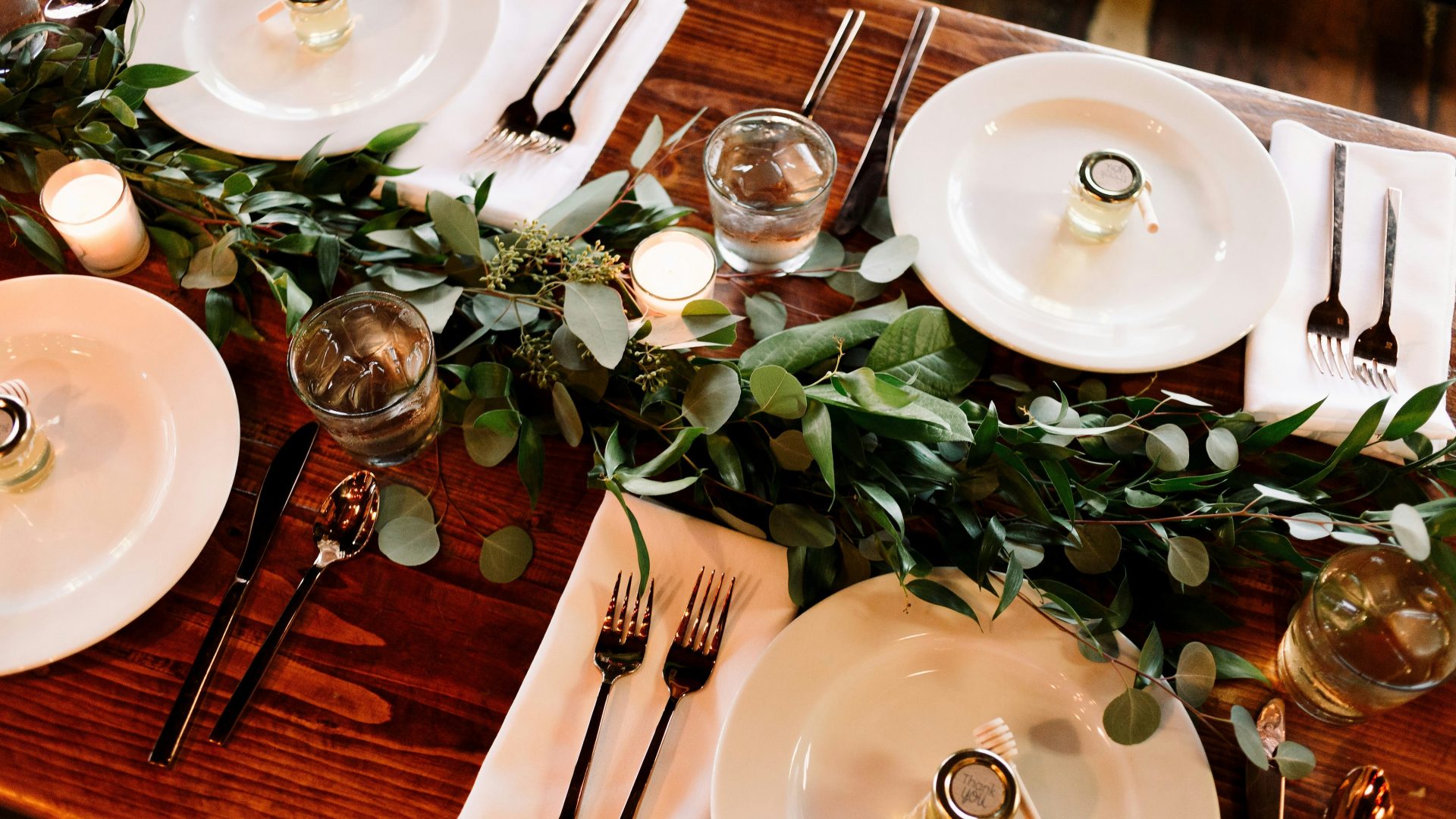 white ceramic dinner plate set on brown wooden table