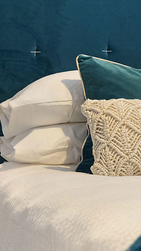 Comfortable bedroom with linens at parcHAUS at Firewheel Parkway