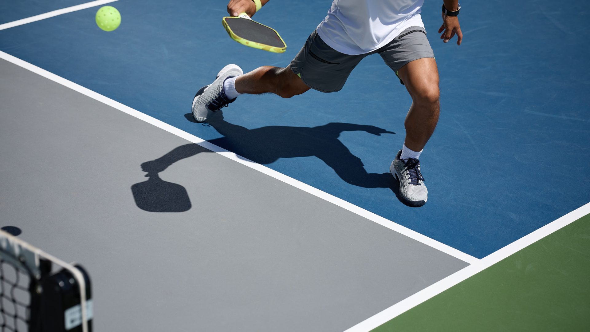 a man is playing tennis on a court at The  Marley