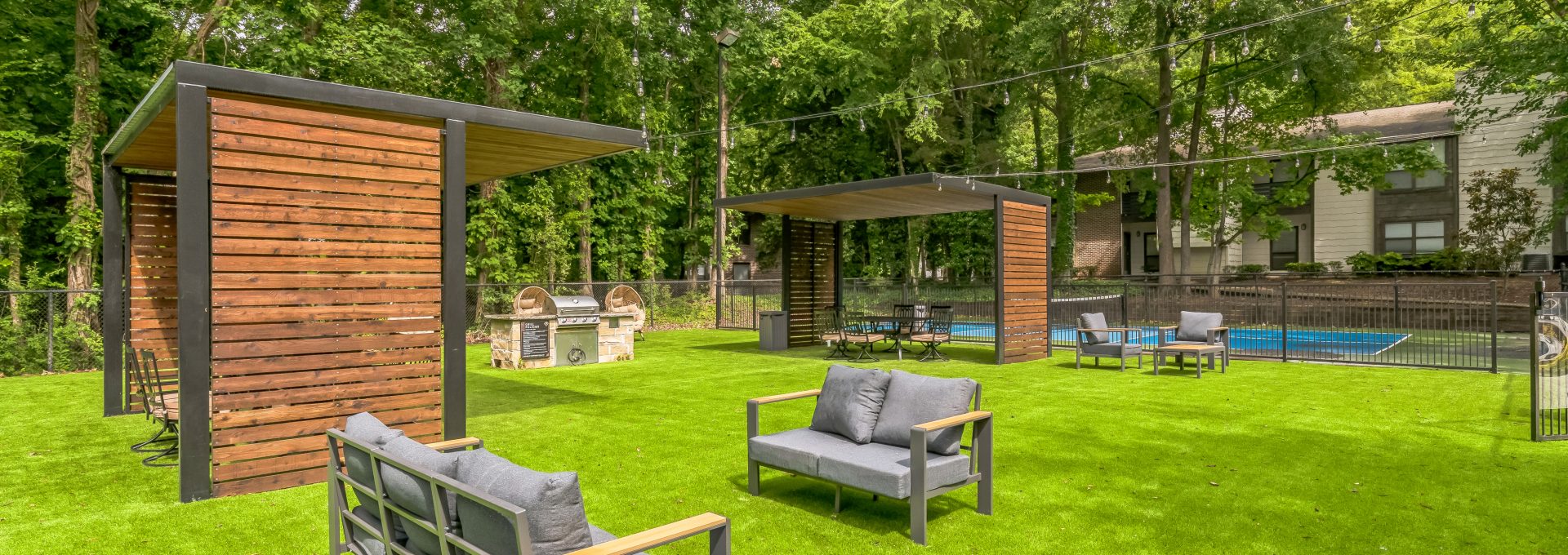 a backyard with a pool and lounge chairs at The  Marley