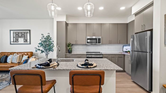 a kitchen with stainless steel appliances and granite countertops at The La Ventana