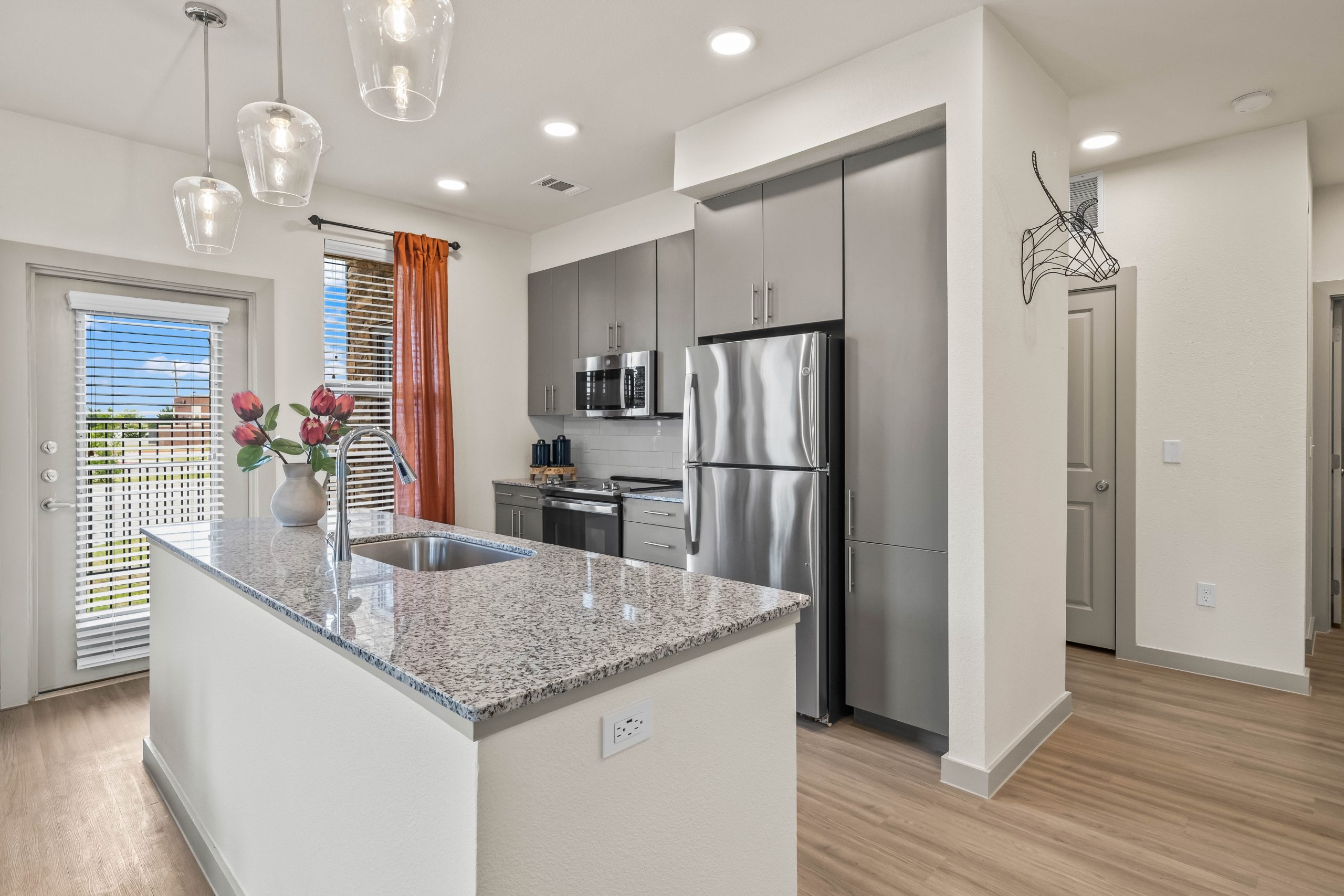a kitchen with stainless steel appliances and granite countertops at The La Ventana