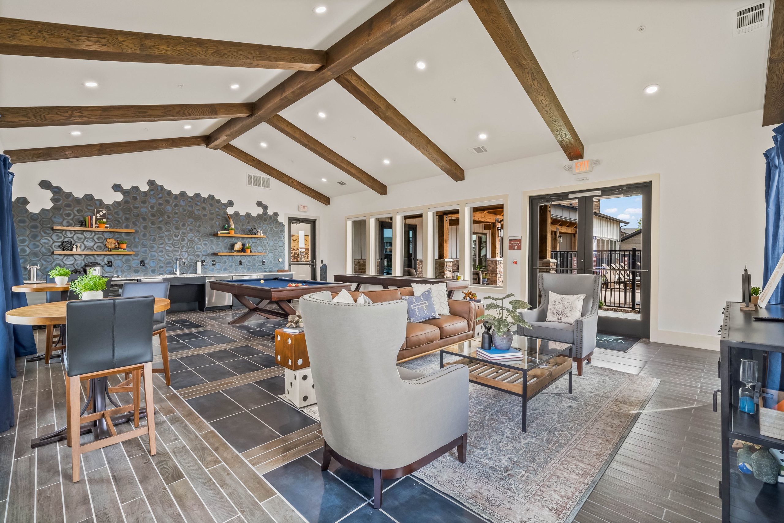 the living room has a wood ceiling and a fireplace at The La Ventana