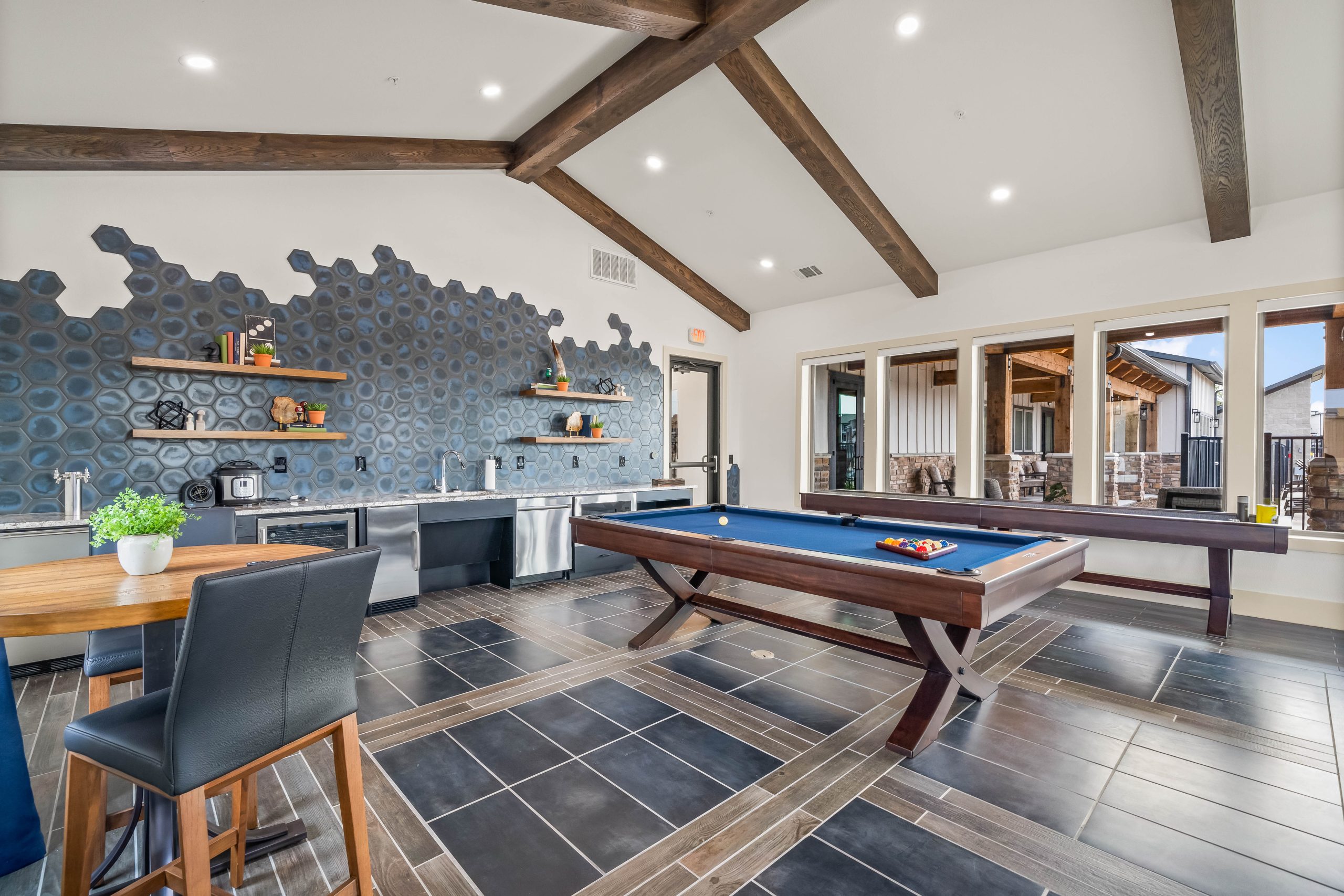 pool table in a game room at The La Ventana at Canyon West Apartments