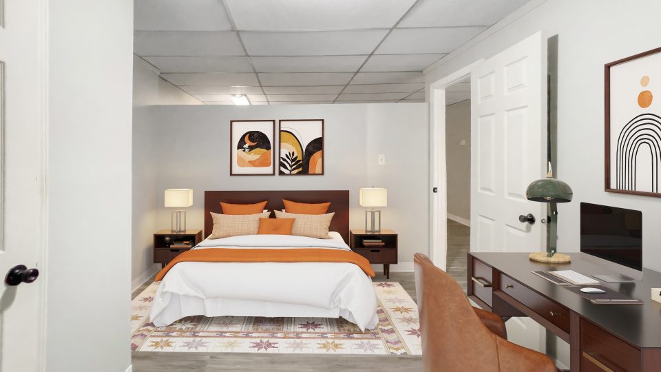 a bedroom with a bed, desk and chair at The Beacon Hill Apartments