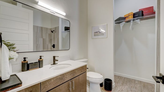 a bathroom with a sink, toilet and mirror at The  Campbell