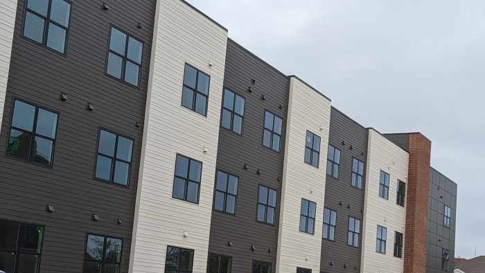 a building with several cars parked in front of it at The  Campbell