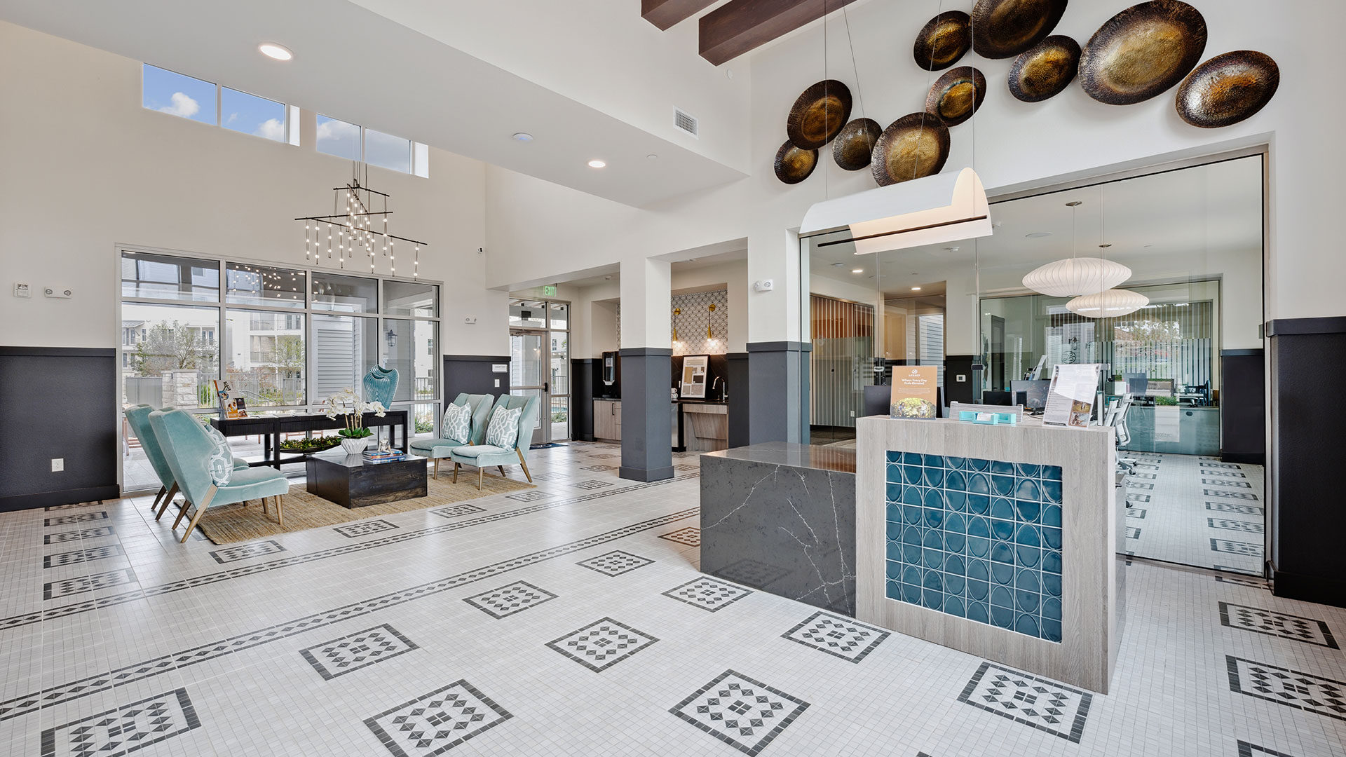 the lobby of a large apartment building with tile floors at The Legacy at Veramendi