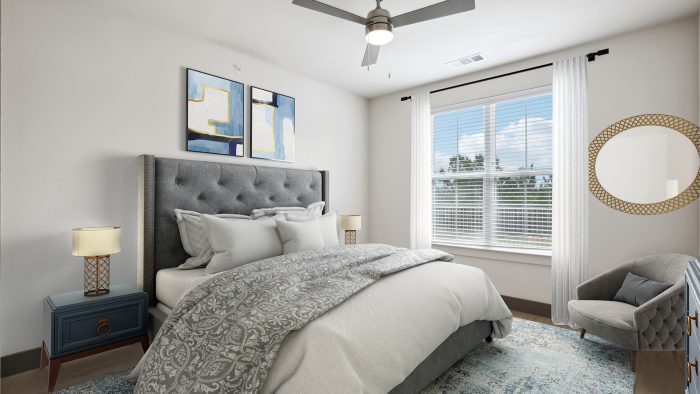 a bedroom with a large bed and a ceiling fan at The Legacy at Veramendi