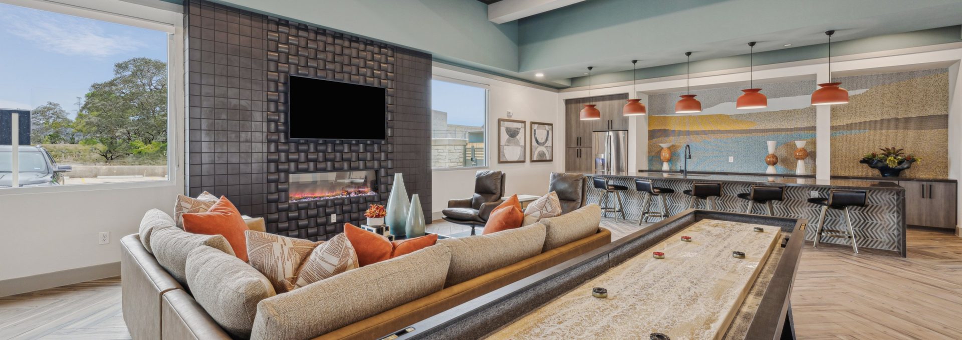 a large living room with a pool table and couches at The Legacy at Veramendi