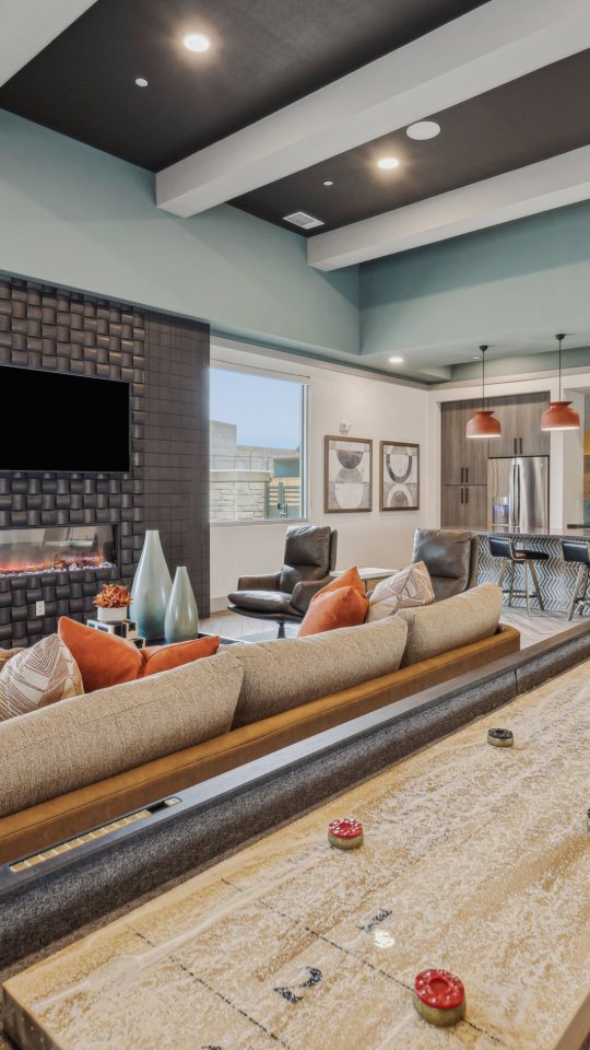 a large living room with a pool table and couches at The Legacy at Veramendi