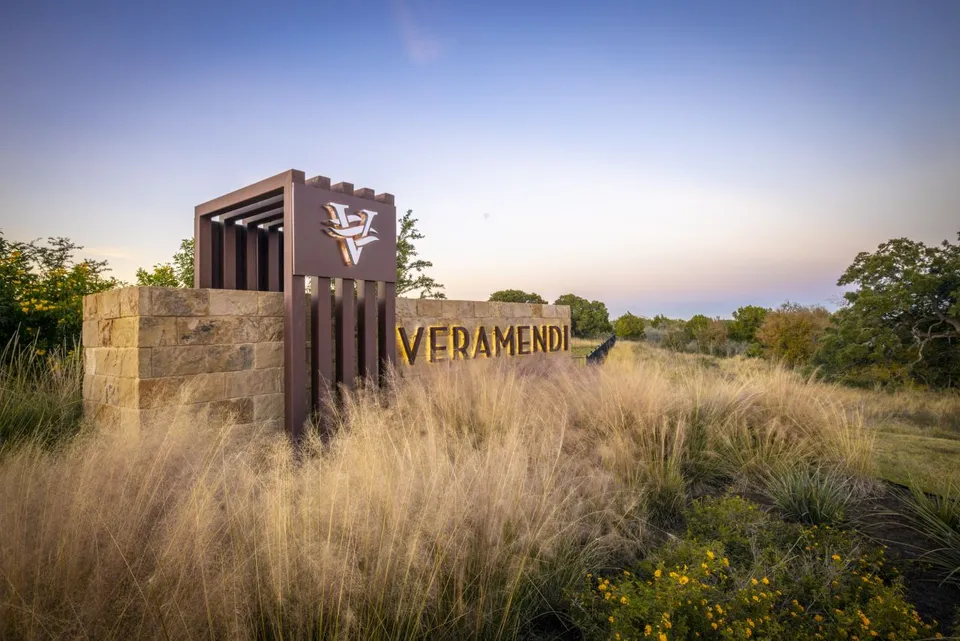 the sign for verdana is shown in the grass at The Legacy at Veramendi