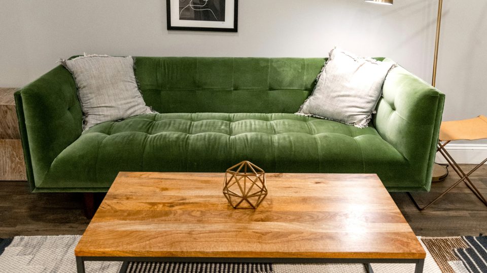 a green couch in a living room with a coffee table at The Tupelo
