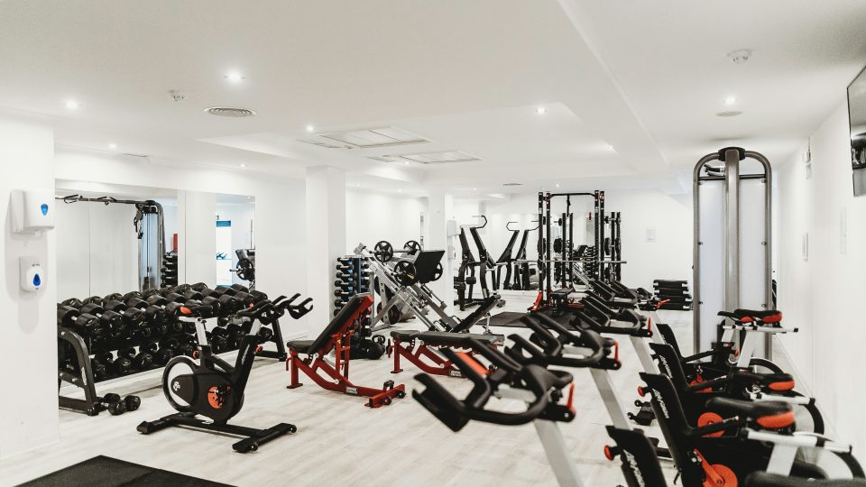 a gym room with equipment and treads at The Tupelo
