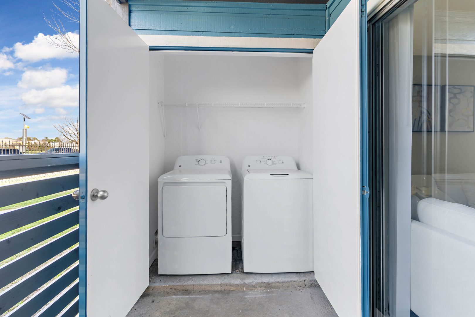 a laundry room with a washer and dryer in it at The Sonoma Apartments
