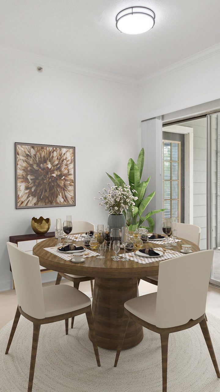 a dining room with a table and chairs at The Stetson