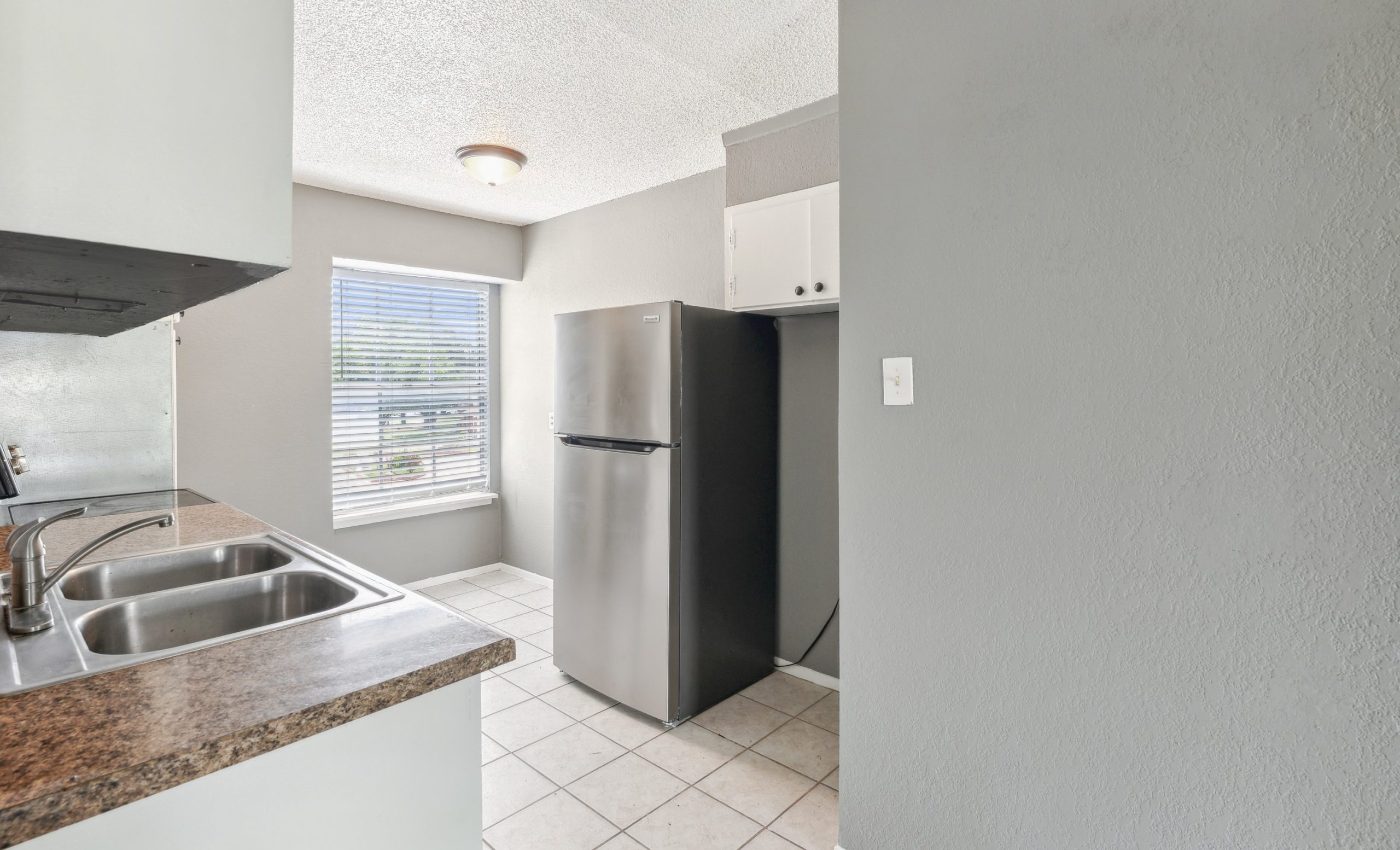 a kitchen with a refrigerator, sink and stove at The Crestwood Terrace