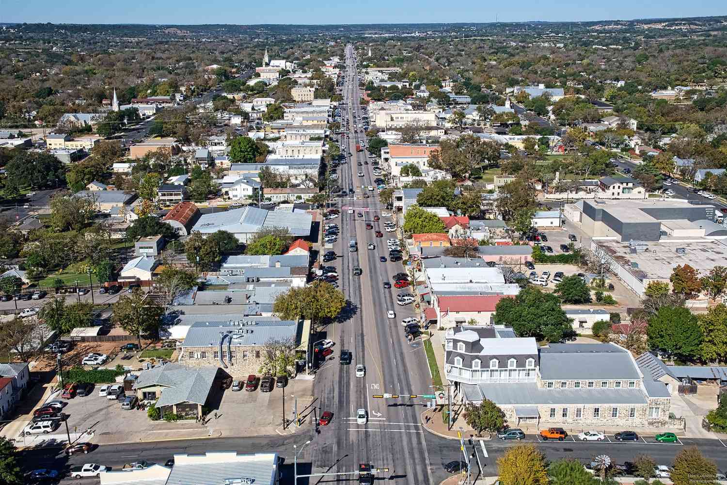 aerial view of a city street with cars and buildings at The Barons Park