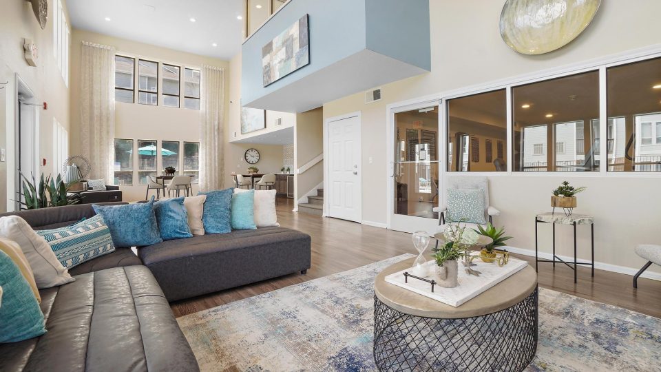 the living room has a large couch and a coffee table at The Residences at Bear Creek
