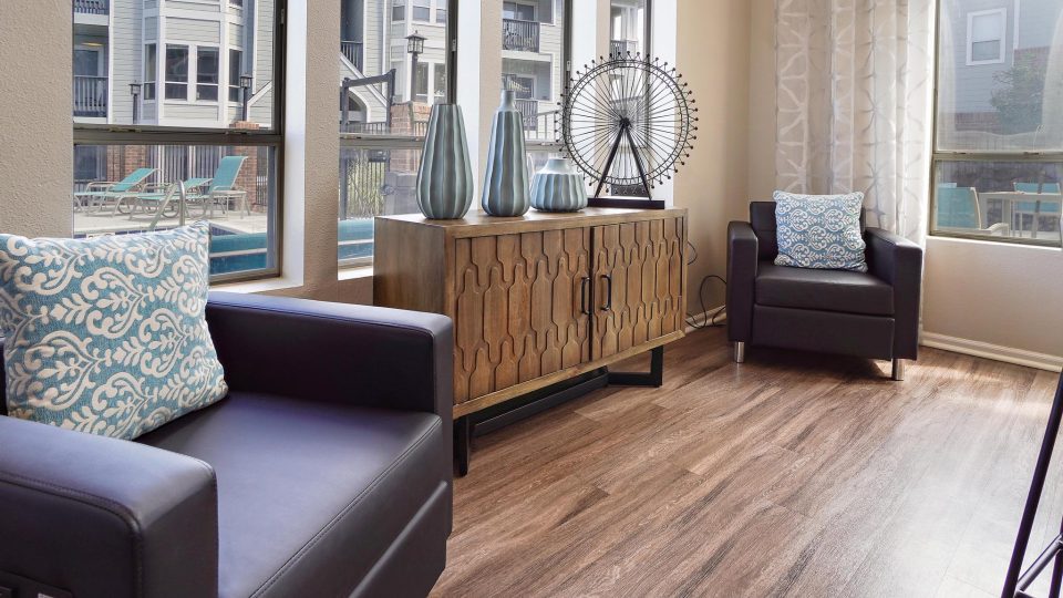 a living room with two couches and a window at The Residences at Bear Creek