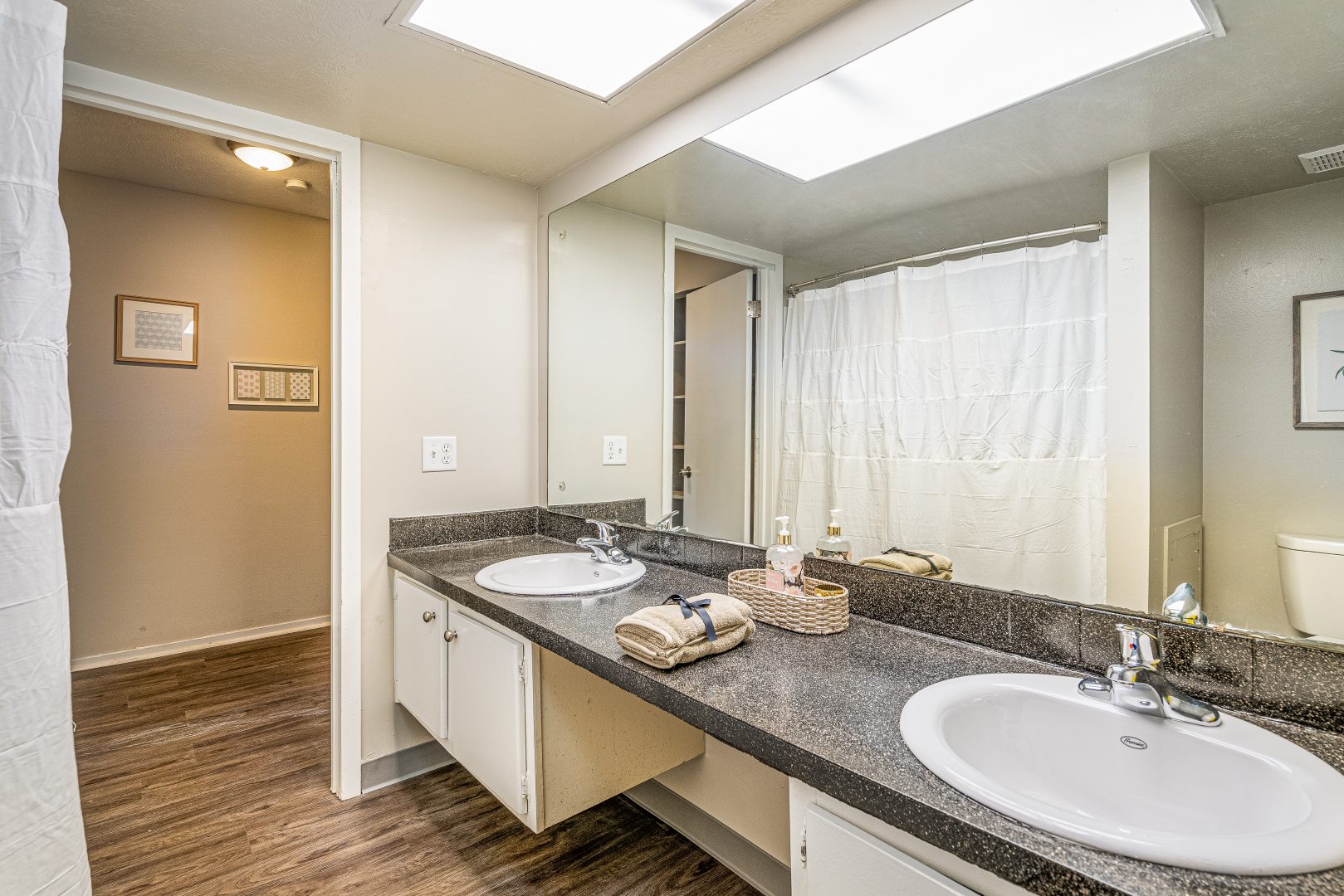 a bathroom with two sinks and a shower at The Lakeshore Cove