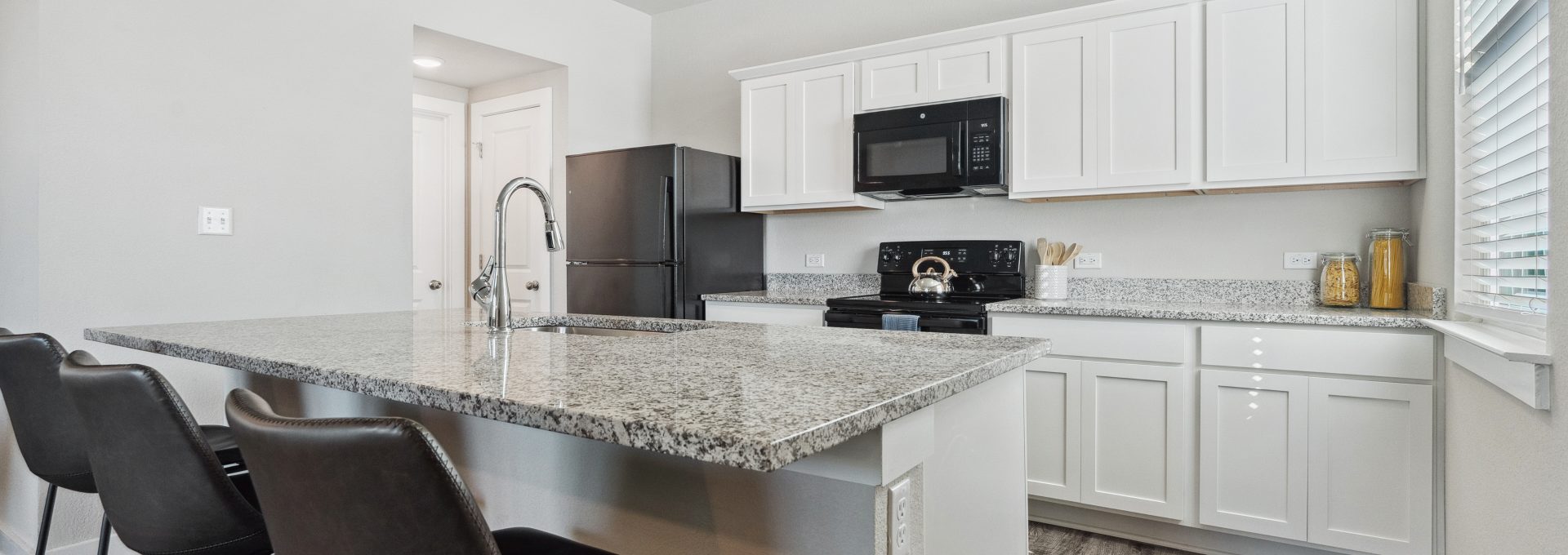 kitchen with granite countertops and stainless steel appliances at The  Powell