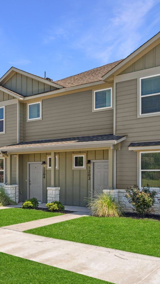 Exterior view of a two-story townhome in The Powell's community