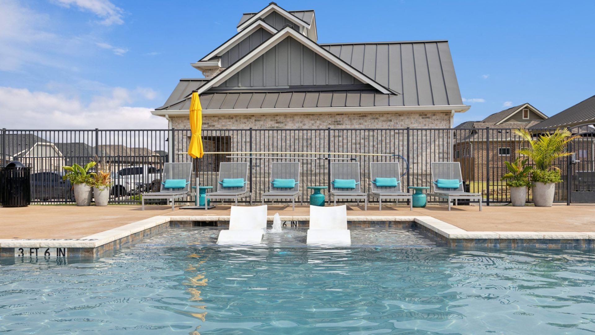 Shelf seating inside the community pool at VLux Stoneridge