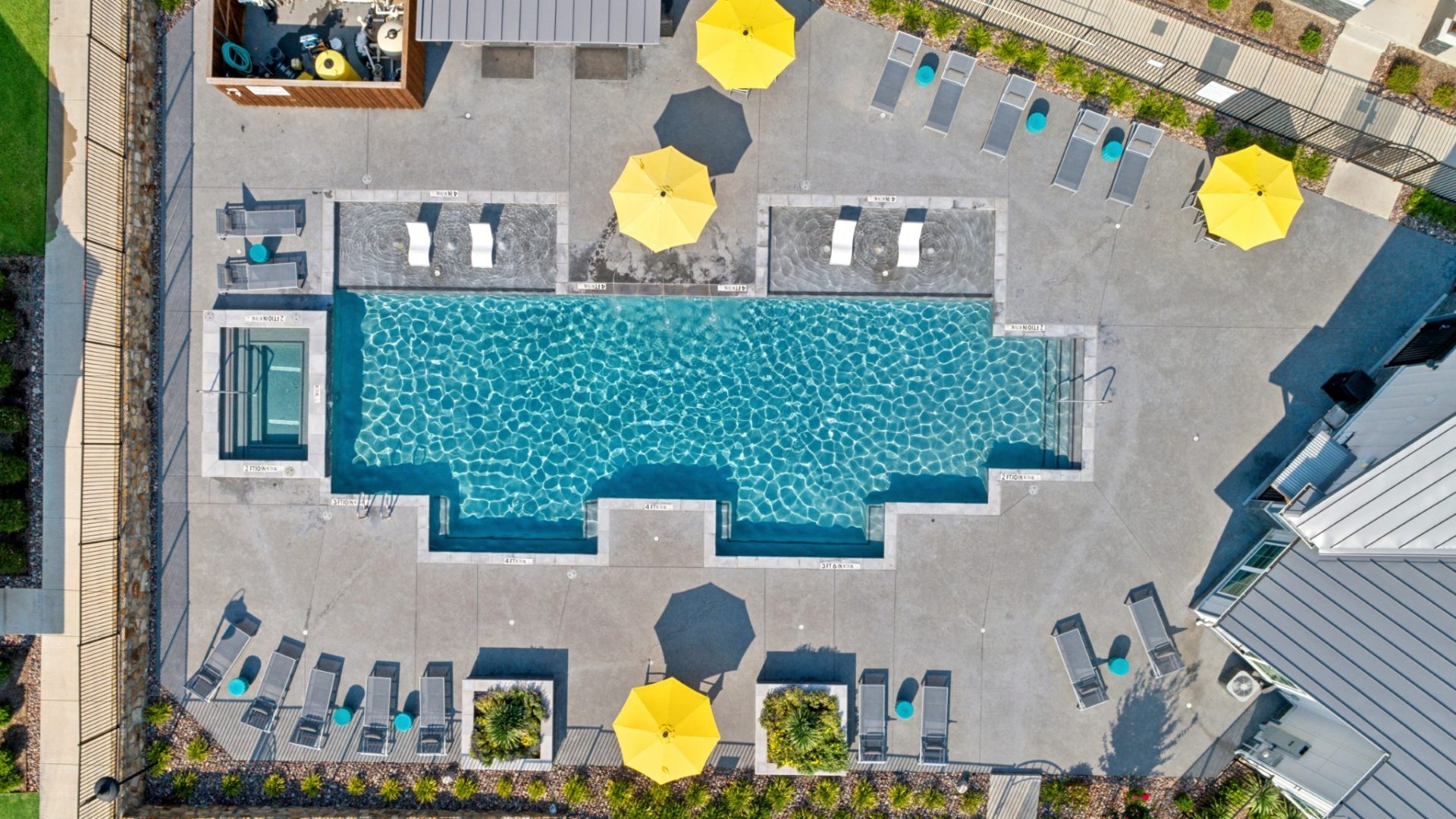 Aerial view of the community swimming pool at VLux Trails