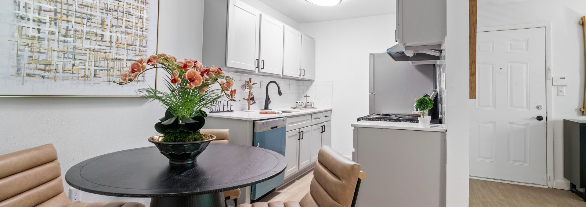 a kitchen and dining room area with a table and chairs at The  Wynne