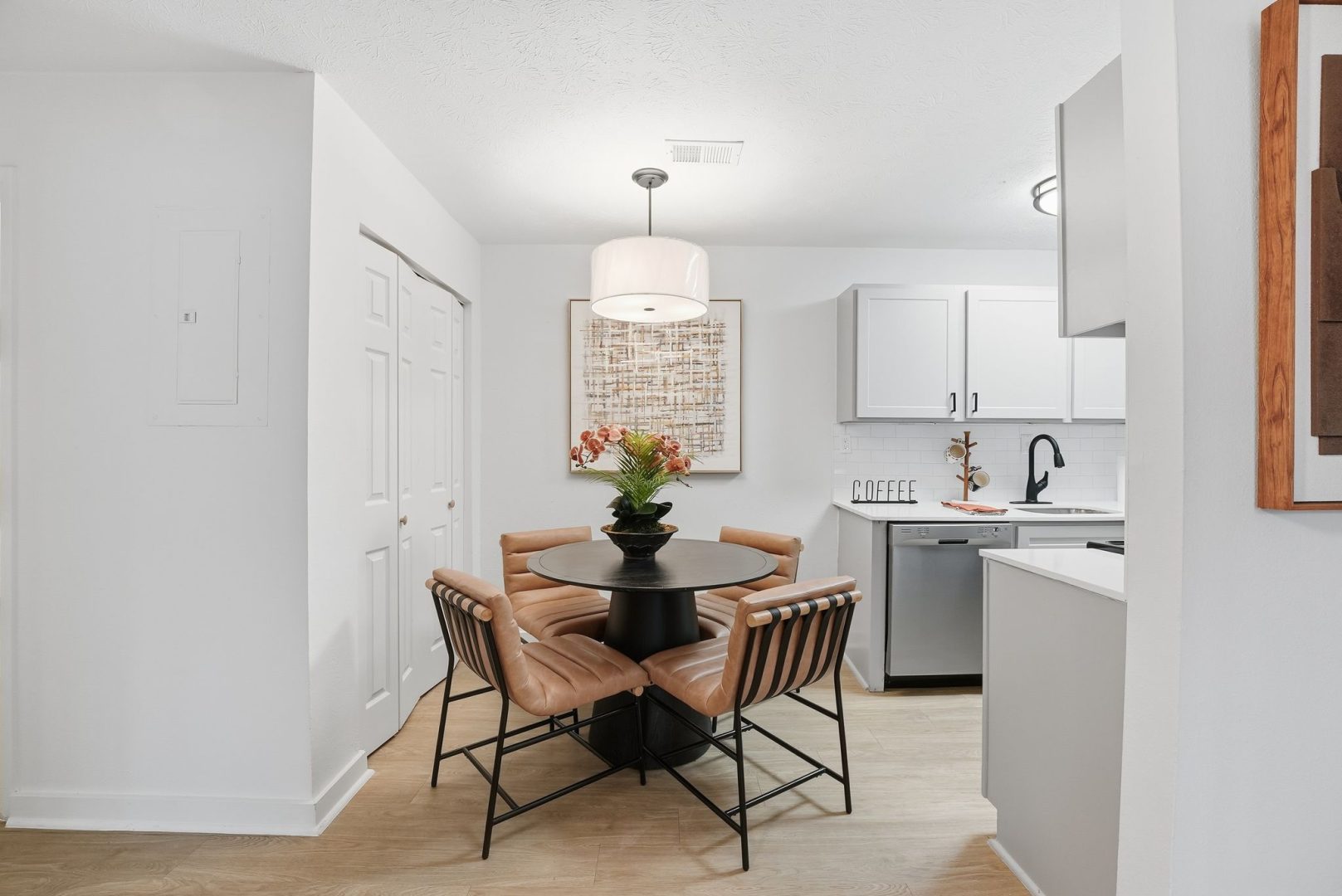a kitchen with a table and chairs in it