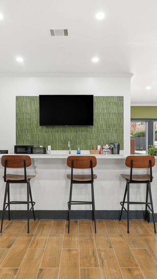 a living room filled with furniture and a tv