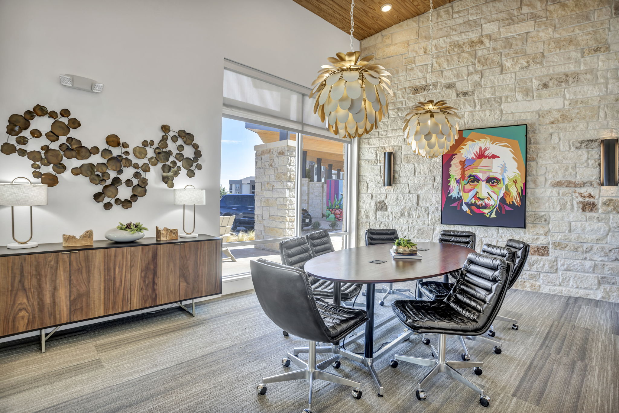 a dining room with a large painting on the wall at The Conley