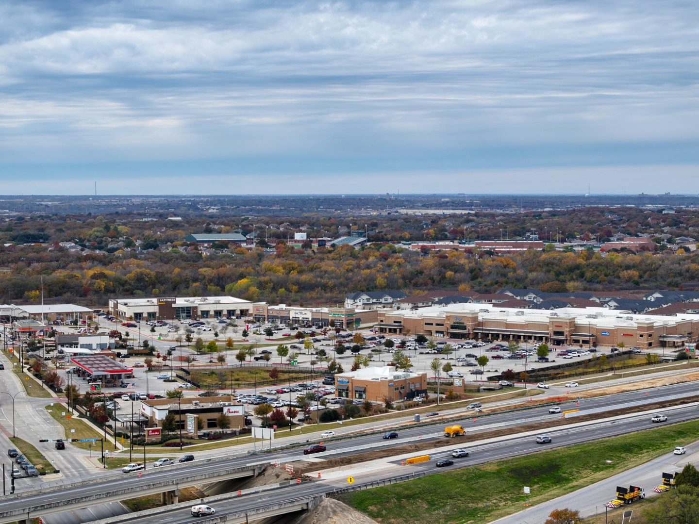 a view of a city from above with a highway in the background at The Town Arlington