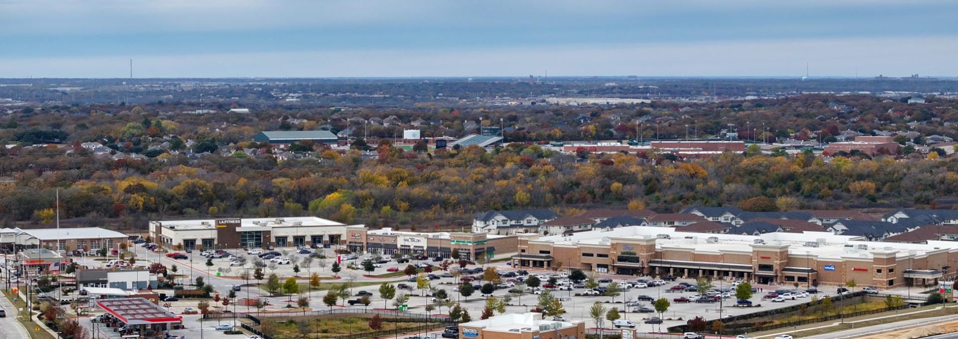 a view of a city from above with a highway in the background at The Town Arlington