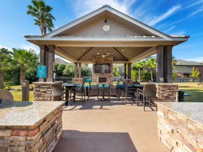 Waterfront picnic pavilion with gas grill and bar seating at Anchor at South Shore in League City, TX