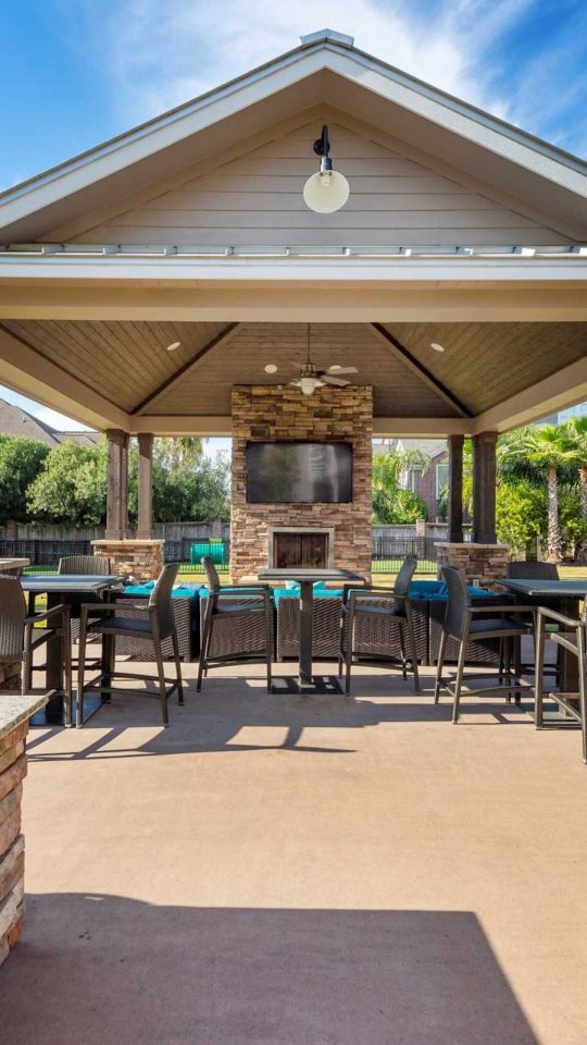 Waterfront picnic pavilion with gas grill and bar seating at Anchor at South Shore in League City, TX